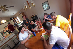 Independence Lodge Sober House residents discuss recovery from drugs and alcohol during lunch